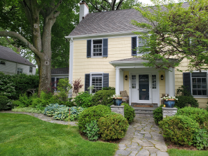 Natural stone path & Pillars with boxwood & deep borders Natural stone path & Pillars with boxwood & deep borders
