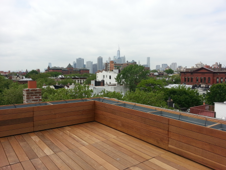 After - New wood deck with  custom weather resistant planters After Brooklyn Roof Garden 1