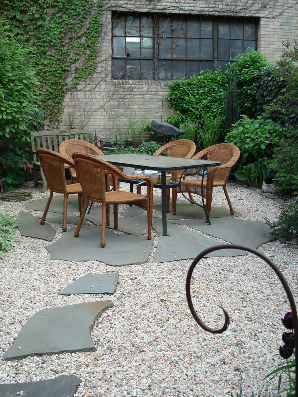 Pea Gravel & Natural Bluestone patio with Shrub border Pea Gravel & Natural Bluestone patio with Shrub border